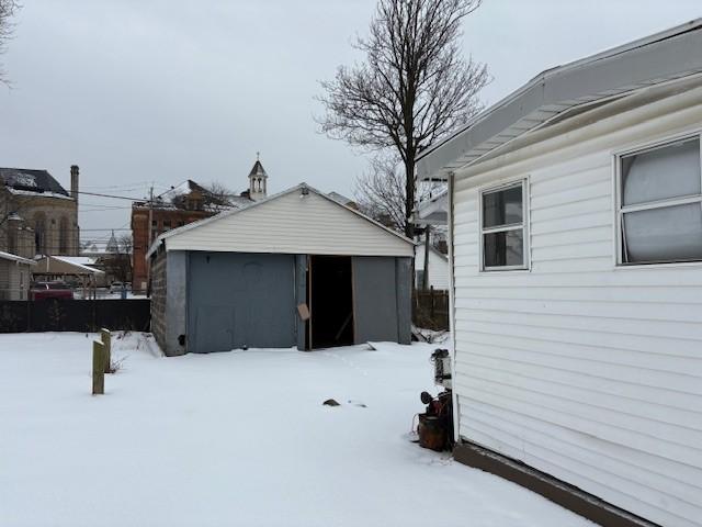 view of snow covered garage