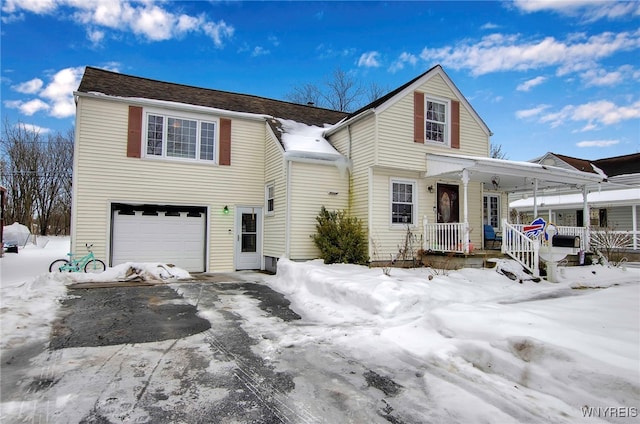 view of front property featuring a garage and covered porch