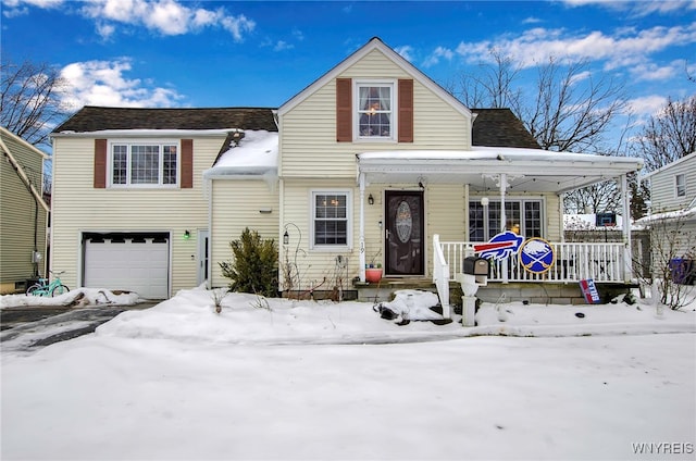 view of front of property featuring a garage and covered porch