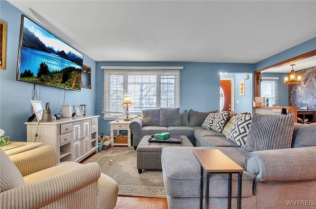 living room with an inviting chandelier