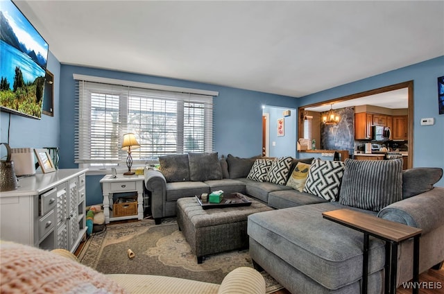 living room featuring hardwood / wood-style flooring and a chandelier