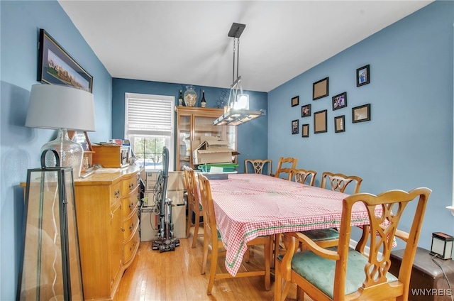 dining area with light hardwood / wood-style flooring