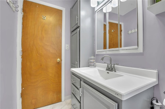 bathroom with vanity and tile patterned flooring