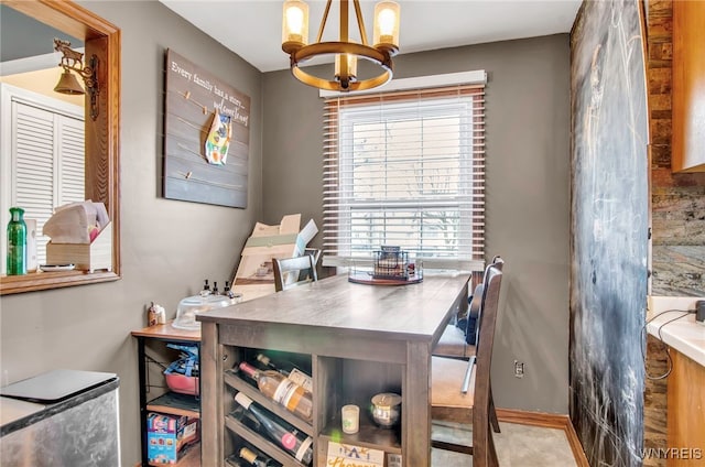 dining space featuring an inviting chandelier