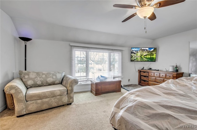 carpeted bedroom featuring vaulted ceiling and ceiling fan