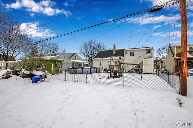 snow covered house with a swimming pool