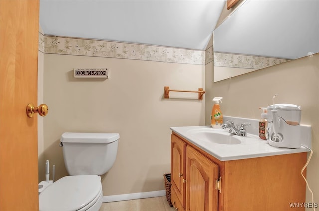 bathroom featuring vanity, toilet, and tile patterned flooring