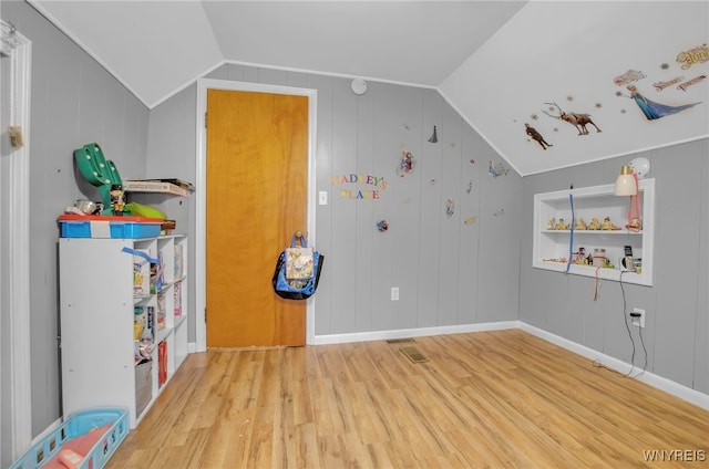 bedroom featuring hardwood / wood-style flooring and vaulted ceiling