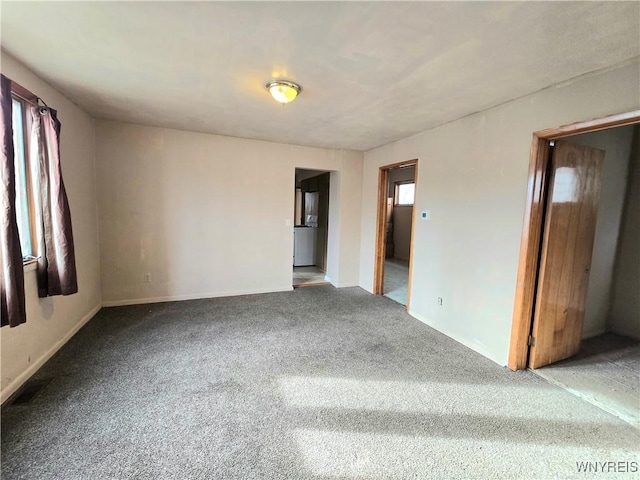 unfurnished room featuring carpet floors