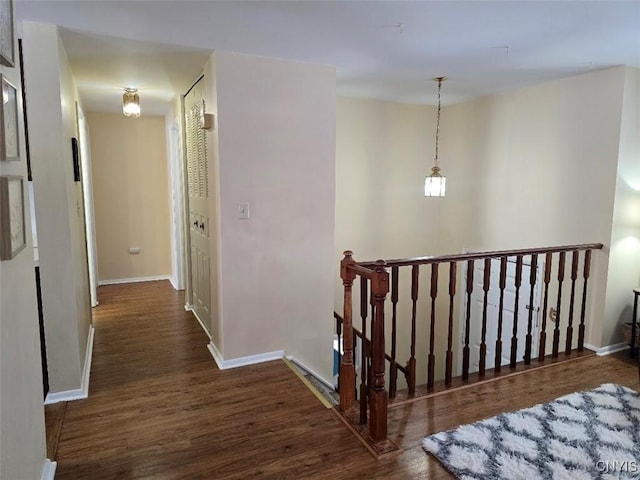 hall with dark hardwood / wood-style flooring