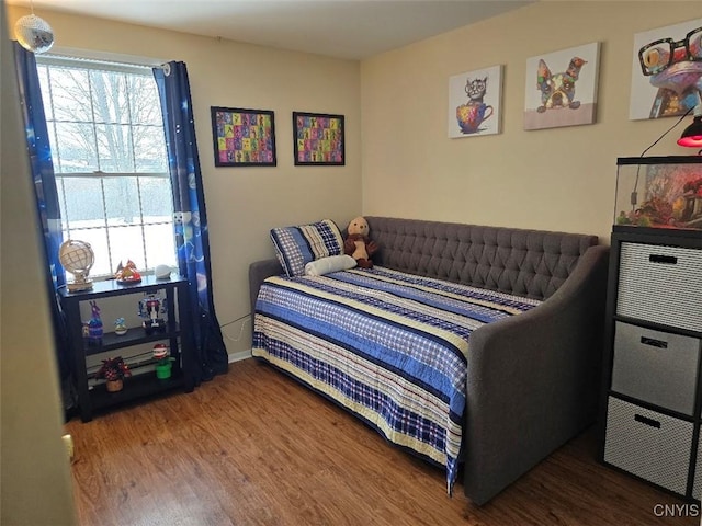 bedroom featuring wood-type flooring