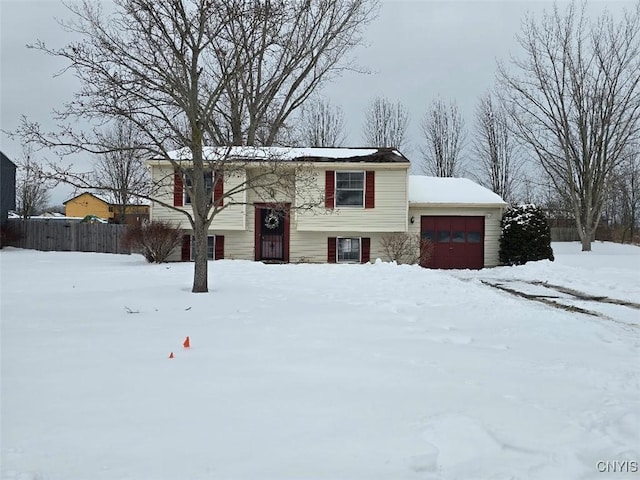 raised ranch featuring a garage