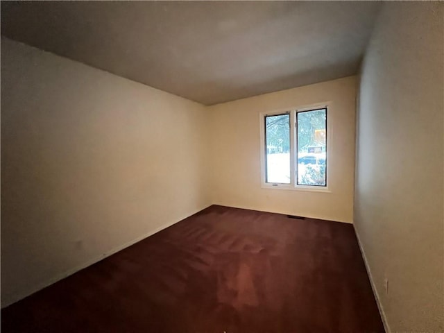 spare room with carpet floors