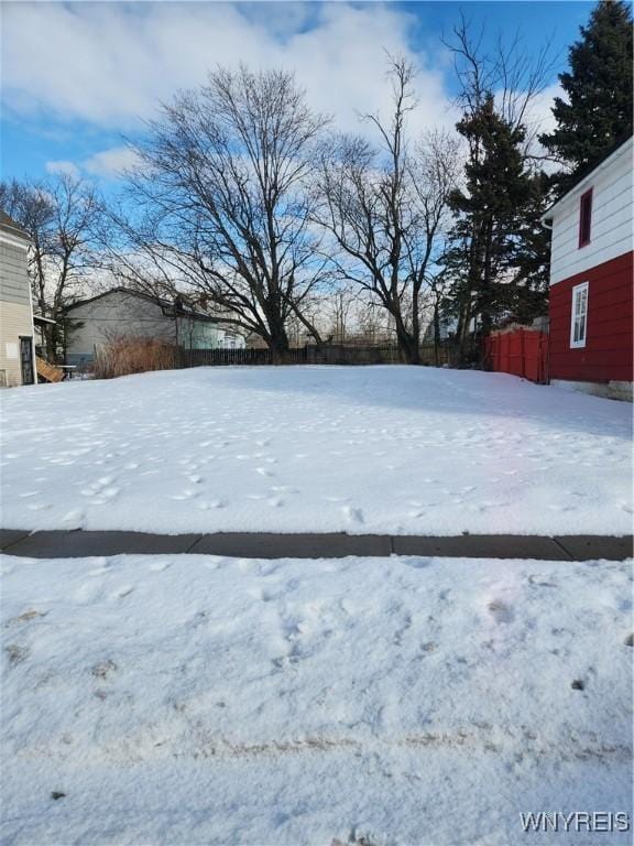 view of yard covered in snow