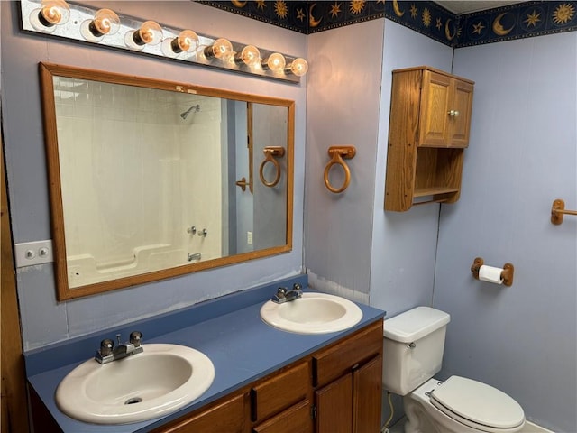 bathroom featuring vanity, a shower, and toilet