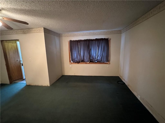 carpeted empty room with ceiling fan and a textured ceiling