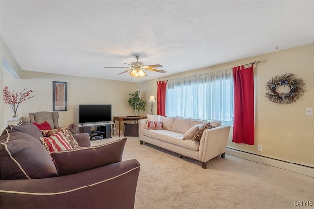 carpeted living room with a baseboard radiator and ceiling fan