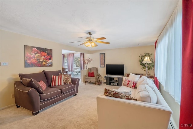 living room featuring light carpet and ceiling fan