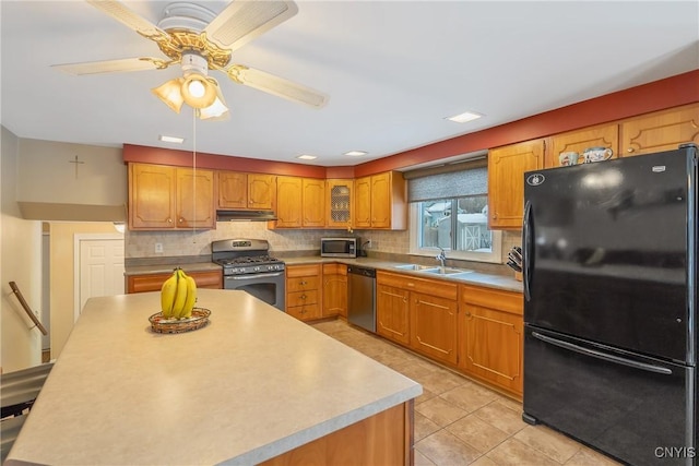 kitchen with stainless steel appliances, sink, light tile patterned floors, and backsplash