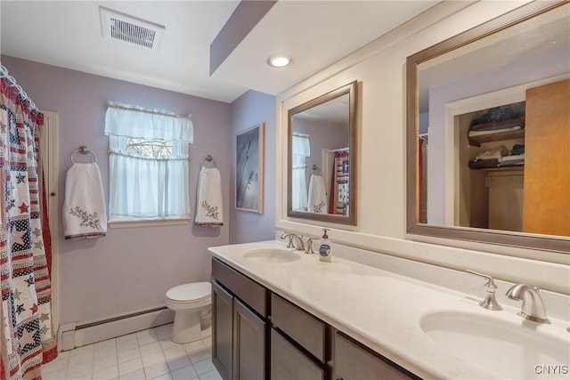 bathroom featuring vanity, a baseboard heating unit, tile patterned flooring, and toilet