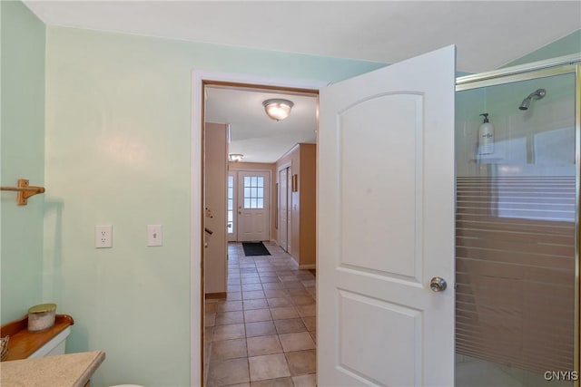 corridor featuring light tile patterned flooring