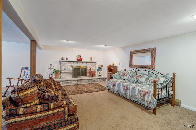 bedroom with a fireplace and carpet