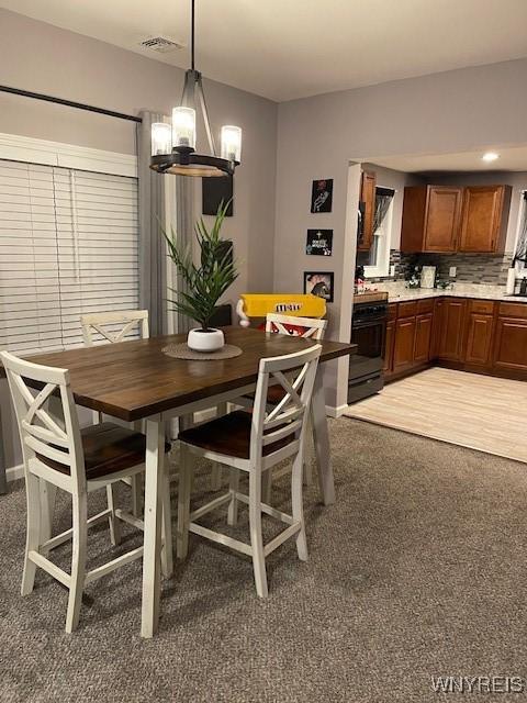 dining room with a chandelier