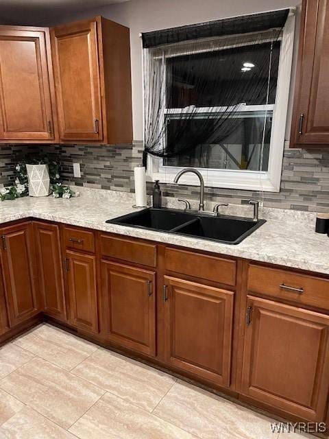 kitchen with sink and decorative backsplash