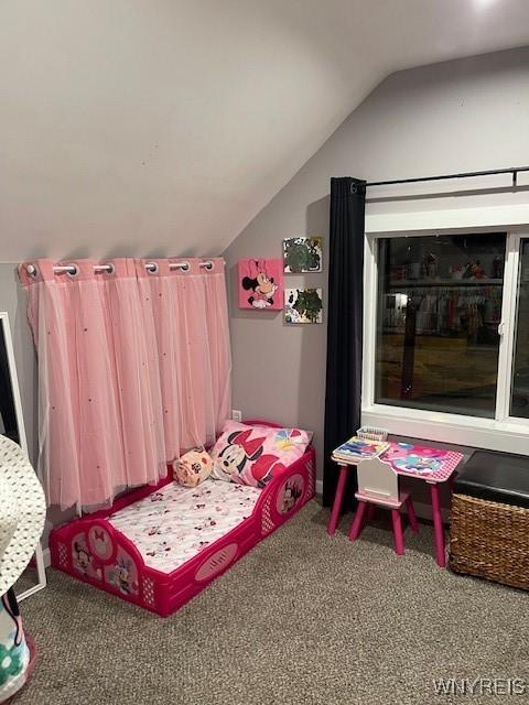 bedroom with lofted ceiling and carpet