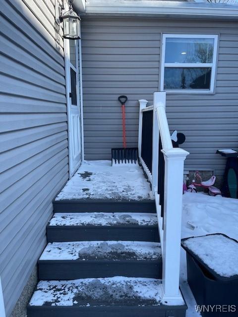 view of snow covered property entrance