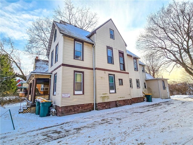 view of snow covered house