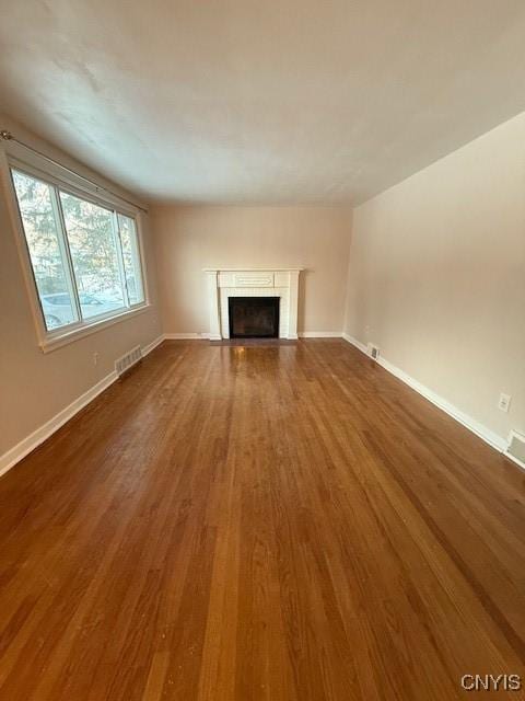 unfurnished living room featuring hardwood / wood-style floors