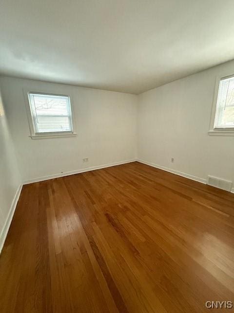 empty room featuring hardwood / wood-style flooring