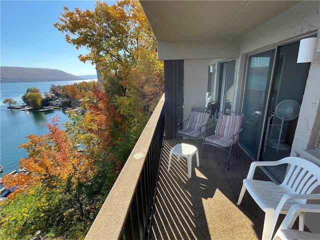 balcony with a water and mountain view