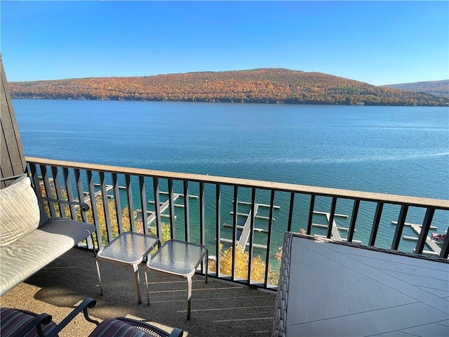 balcony with a water and mountain view