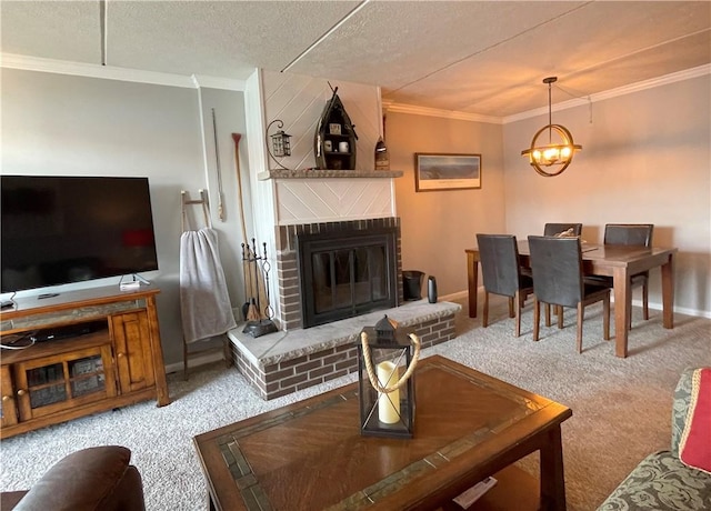 living room with a chandelier, a textured ceiling, ornamental molding, carpet floors, and a fireplace