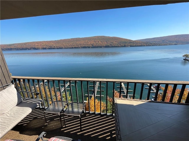 balcony with a water and mountain view