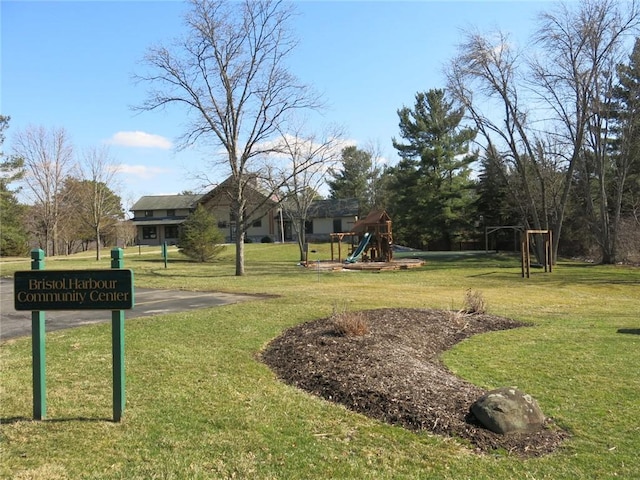 view of property's community featuring a yard and a playground