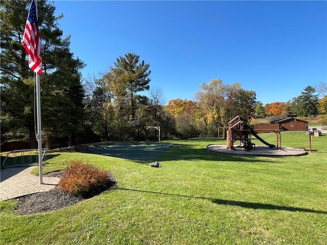 view of property's community with a playground and a lawn