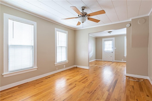 spare room featuring ceiling fan, ornamental molding, and light hardwood / wood-style flooring