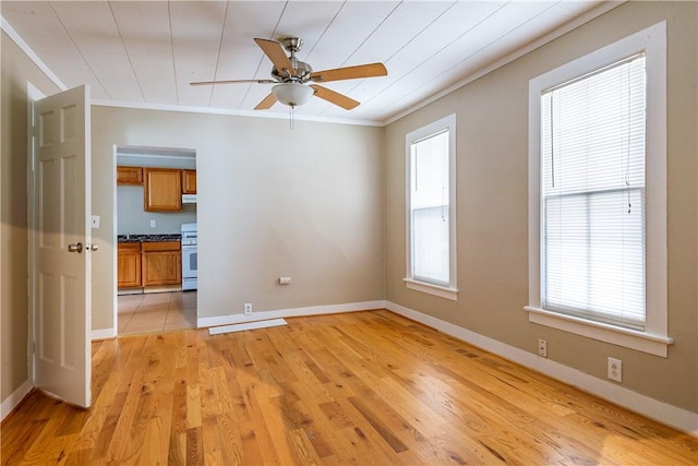 unfurnished room featuring ceiling fan, ornamental molding, and light hardwood / wood-style flooring