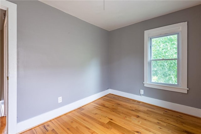 spare room with light wood-type flooring