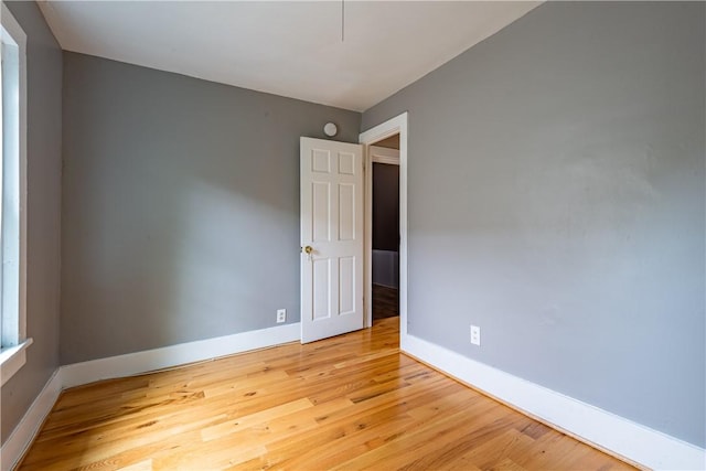 spare room featuring hardwood / wood-style floors