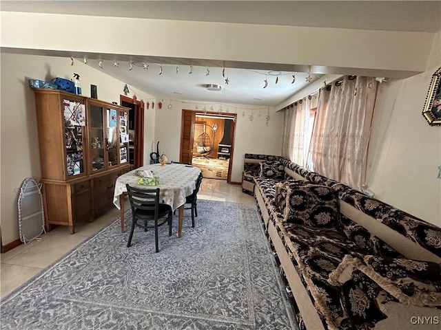 tiled dining area with rail lighting