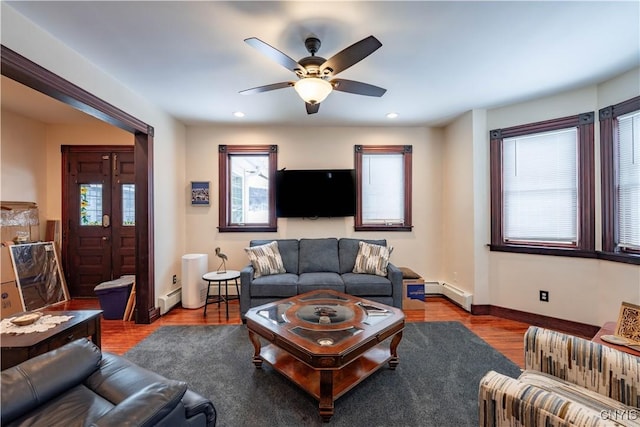20 Petrie St, Little Falls-City, NY 13365 - living room with plenty of natural light, wood-type flooring, and a baseboard heating unit
