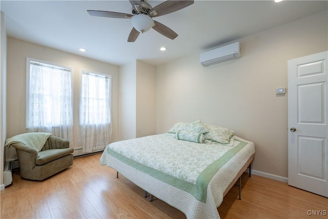 20 Petrie St, Little Falls-City, NY 13365 - bedroom with ceiling fan, a baseboard radiator, light hardwood / wood-style floors, and a wall mounted AC