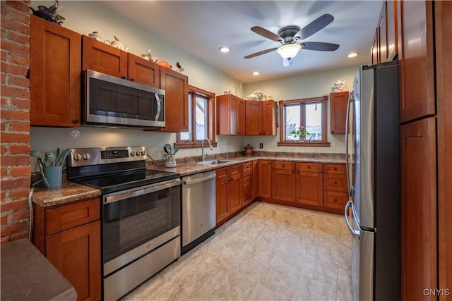 20 Petrie St, Little Falls-City, NY 13365 - kitchen featuring appliances with stainless steel finishes, sink, dark stone countertops, and ceiling fan