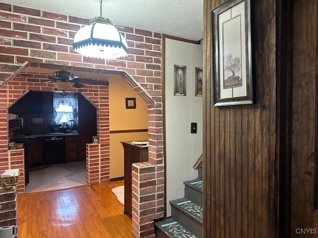 corridor featuring wood-type flooring