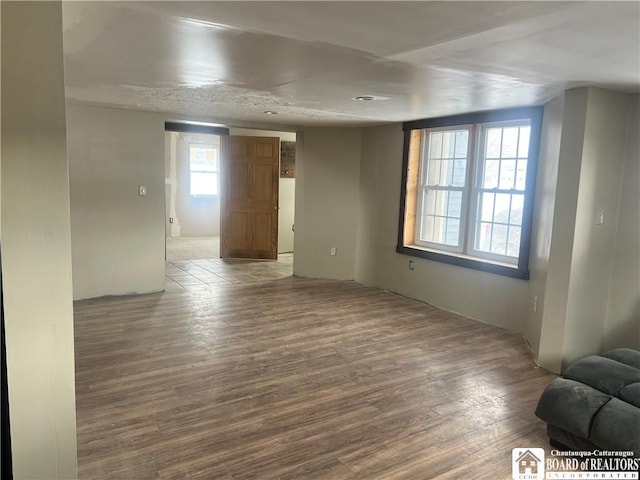 unfurnished room featuring hardwood / wood-style floors