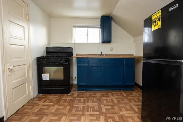 kitchen featuring blue cabinets, black appliances, and a sink